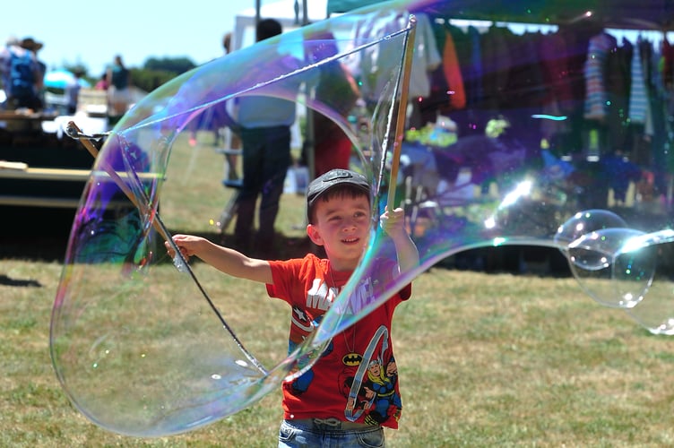 MDA240623A_SP004 Photo: Steve Pope
Giant bubble creating by five year old Saul Wreford at last year's  Ogwell Summer Fair