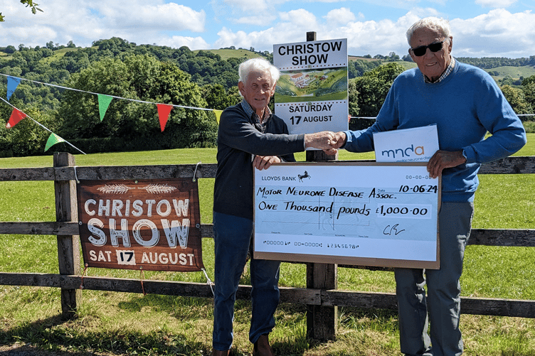 Show Chairman, Peter Preston, presenting a cheque for £1,000 to Bernard Stamp, a representative from MND Association Exeter and East Devon Branch