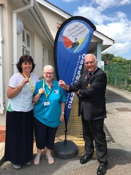 Sally Preston (office manager), Kathy Thornton (Admin volunteer) and Richard Hayward of Dawlish presenting the pin badges.