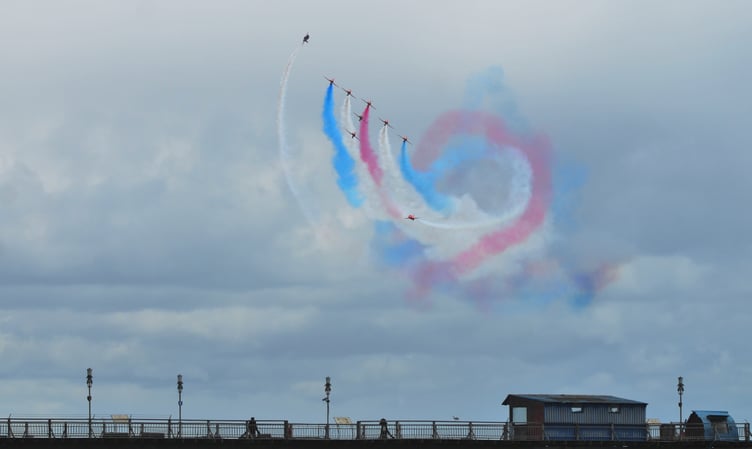 The Red Arrows roll in over Teignmouth Pier