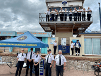 Recordbreaker delivers anniversary flag to Teignmouth NCI