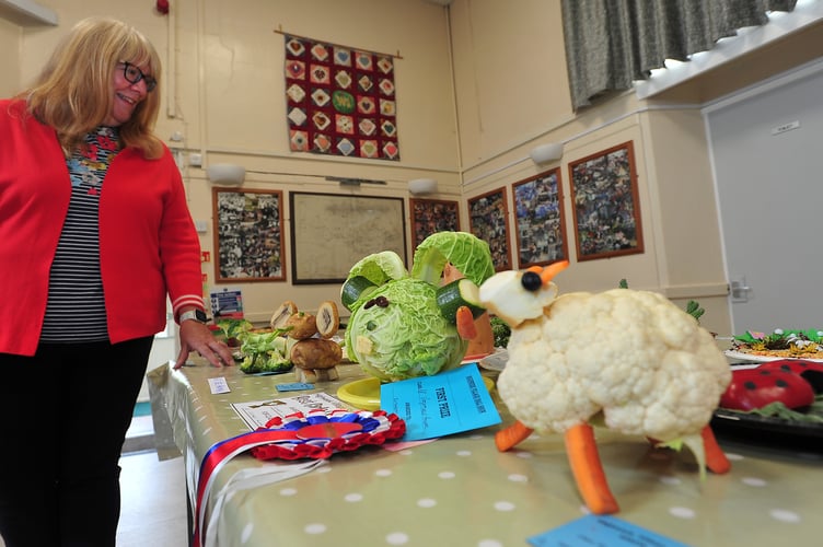 Highweek Village Show. Wendy Newall admires the vegetables masquerading as wildlife