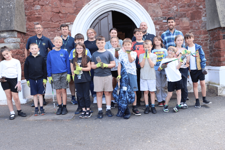 Year 4 pupils from Hazel Class tending to the grounds of St James' church