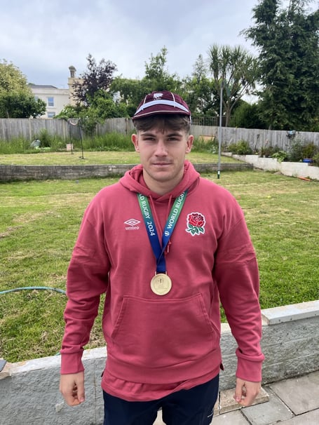 Ben Coen with his winners medal and cap