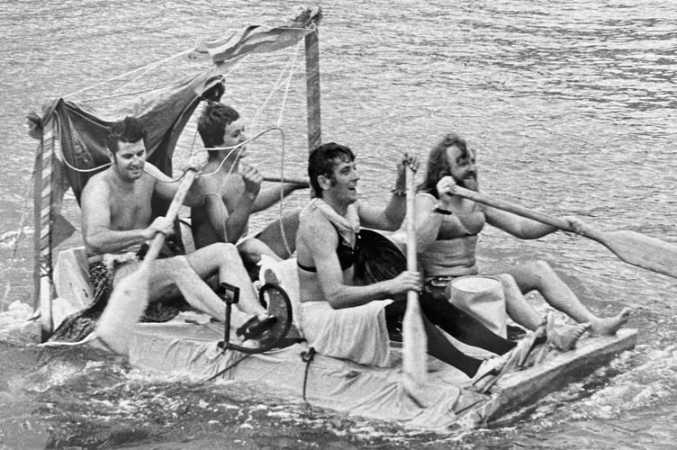 Whatever floats your boat at Dawlish Regatta from August 1973. The winning team from Dawlish Sailing Club cross the line 