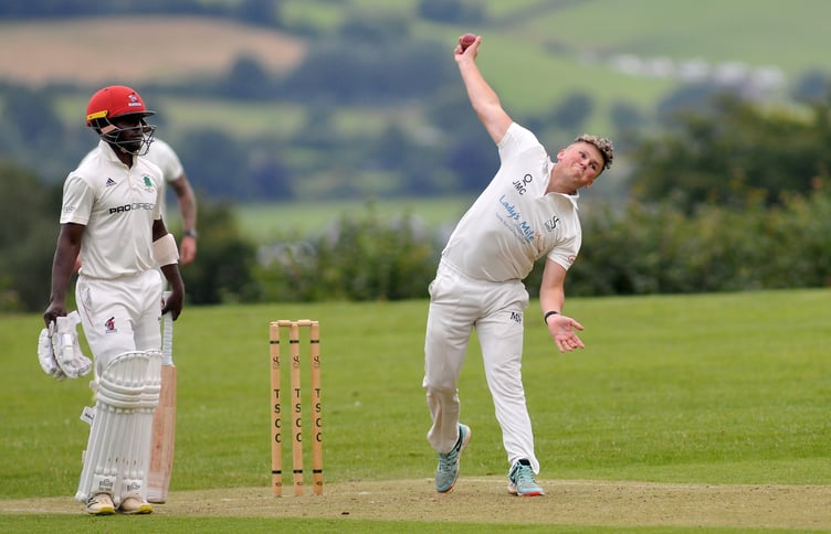 Devon Cricket League B Division.Teignmouth and Shaldon versus Barton. T&S bowler Josh Couch prepares to send a ball down watched by Barton's Tarisai Masakanda