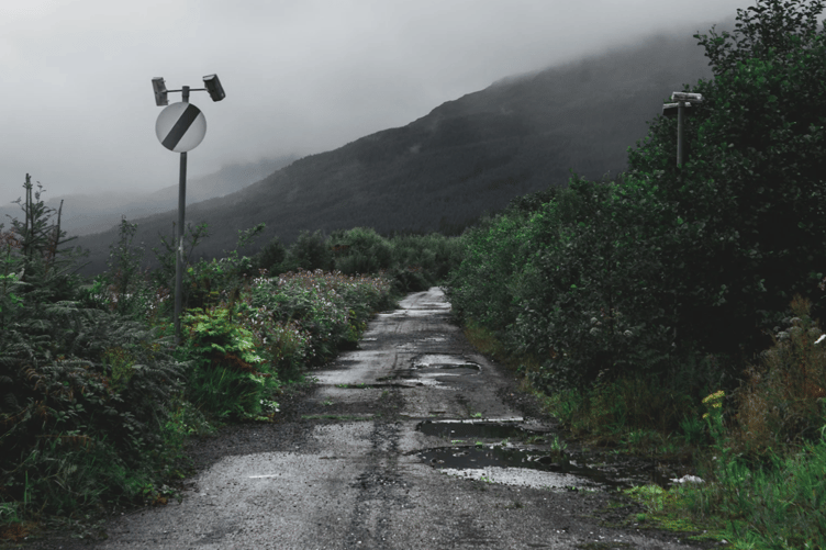 A typical, pothole ridden, country road in the UK