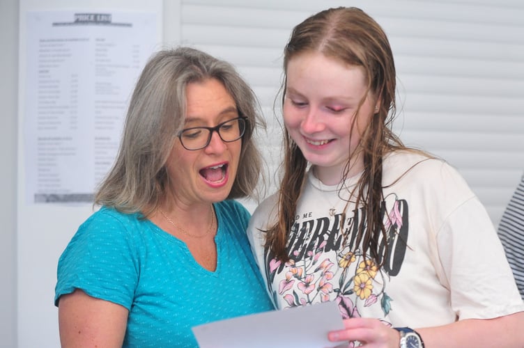 A-Level results day at Teign School, Kingsteignton. 
Moment of truth as Rose Young from Chudleigh opens the envelope, watched by her mum Katie Young
 'I've got A-Level passes in Biology and Maths plus a BTEC in Computer Science,' she excitedly revealed.
"I'll now be heading up to Gloucester University where I'll be studying Biology for the next three years.'