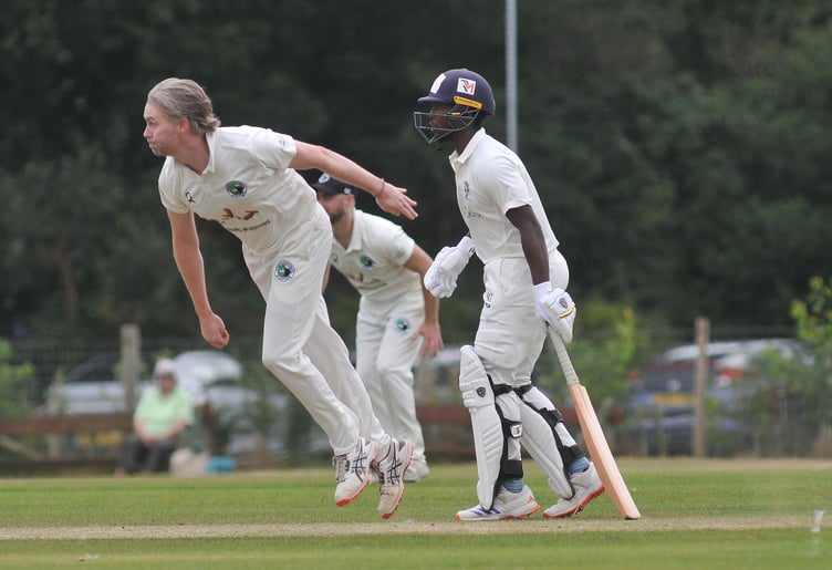 Devon Cricket League Premier Division.  Bovey Tracey versus Bradninch & Kentisbeare. Bradninch bowler Mitchell Pugh and Bovey batsman Musa Twala