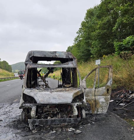 The burnt out remains of the van on the A38. Photo: Bovey Tracey Fire Station