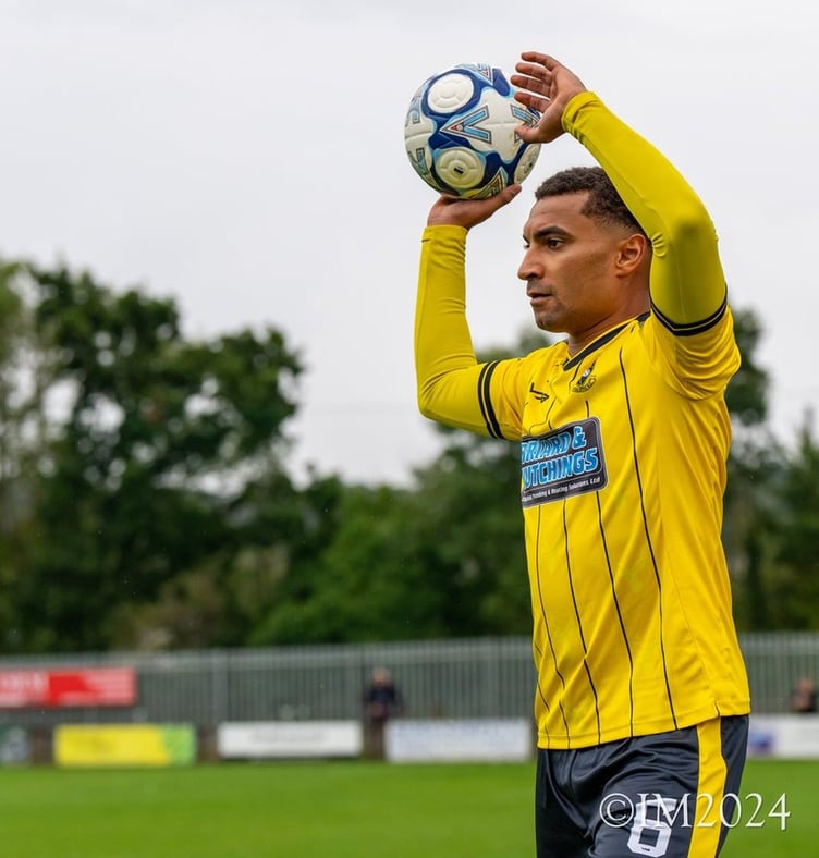 Myles James preparing to take a throw-in for Buckland