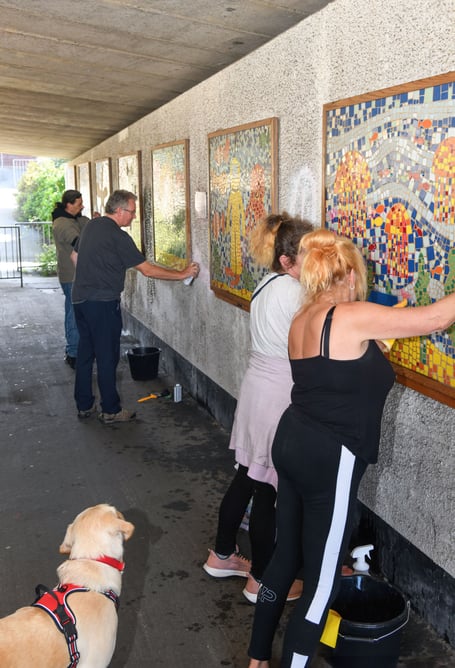 Volunteers cleaning up graffiti in a Teignmouth subway