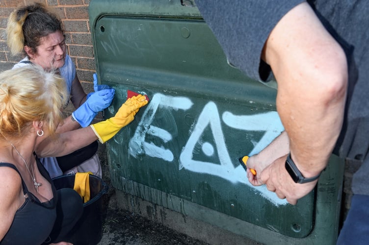 Covering up graffiti 'tags' around Teignmouth