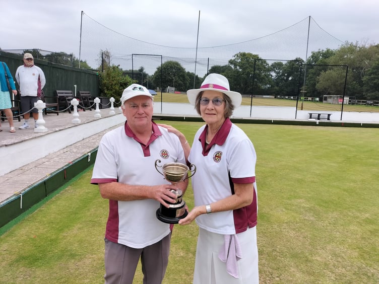 Chudleigh Bowls' ladies club champion Margie Wilson is presented with her trophy
