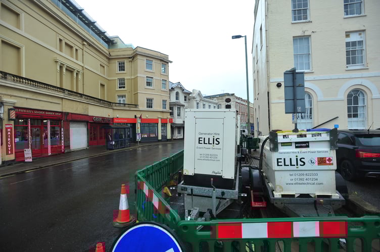 Generators providing electrical power in the centre of Teignmouth after a power outage affected hundreds of residential properties and businesses in the town 