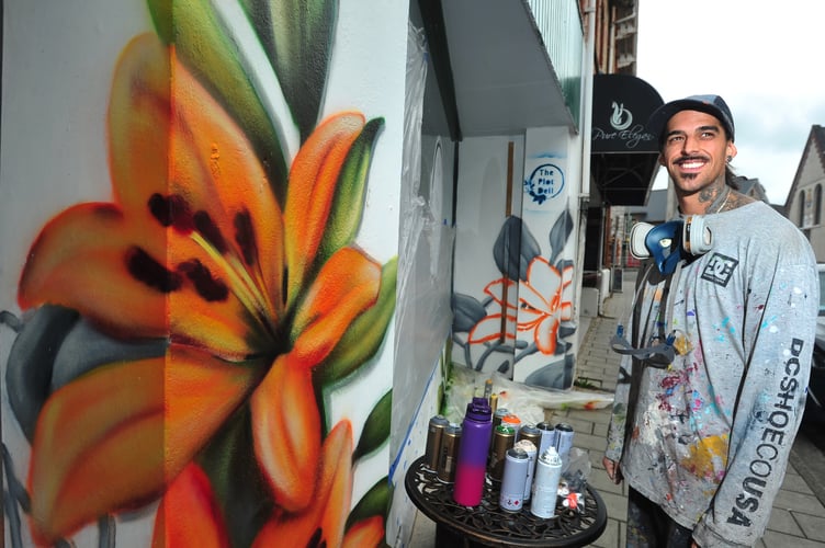 International muralist Sebastian Oyarbide (aka Sebacener) at work in Newton Abbot.