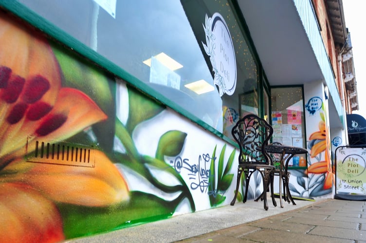 International muralist Sebastian Oyarbide (aka Sebacener) at work in Newton Abbot.