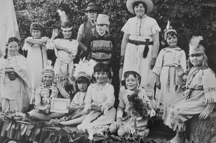 Archive. Ogwell Carnival from September 1981. 1st Ogwell and Denbury Brownies around the camp fire