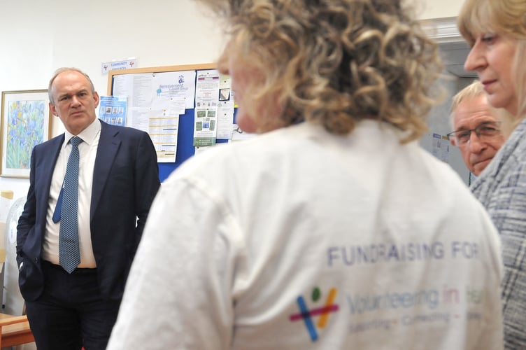 Liberal Democrat leader Ed Davey visits Teignbridge. Ed Davey listens  with concern to the fears of Volunteering in Health volunteers at Teignmouth Hospital