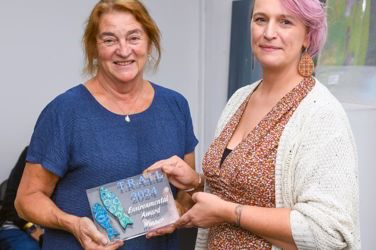 Rose Bailey receiving the Environmental Award for the Make it Thursday (MIT) sculpture 'Reflective Waves: Balance of Nature' in the 2024 Teignmouth Recycled Art in the Landscape (TRAIL) exhibition