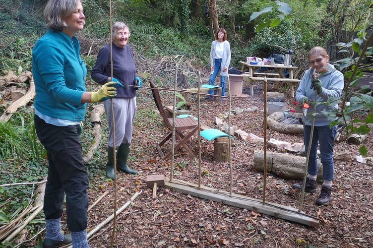 Dainton Copse volunteers preparing forest school activity zones