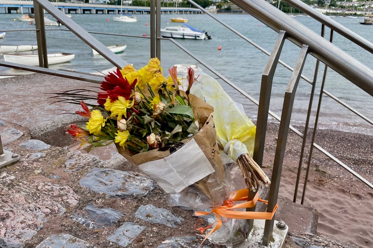 Floral tributes were left by the River Teign in Shaldon near where Sam Bucknall's boat, 'Blue Pearl' was moored.
