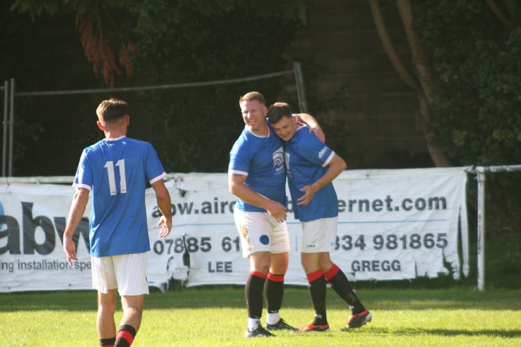 Nick Rudge (right) celebrates scoring Spurs' opener against Millbrook