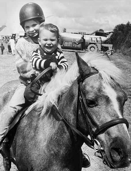 June 1986. Broadhempston Fete. Clare (7) and Tom Harvey (1) on Tigger