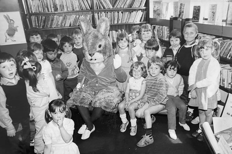 June 1986.  Peter Rabbit visits youngsters at Teignmouth Library