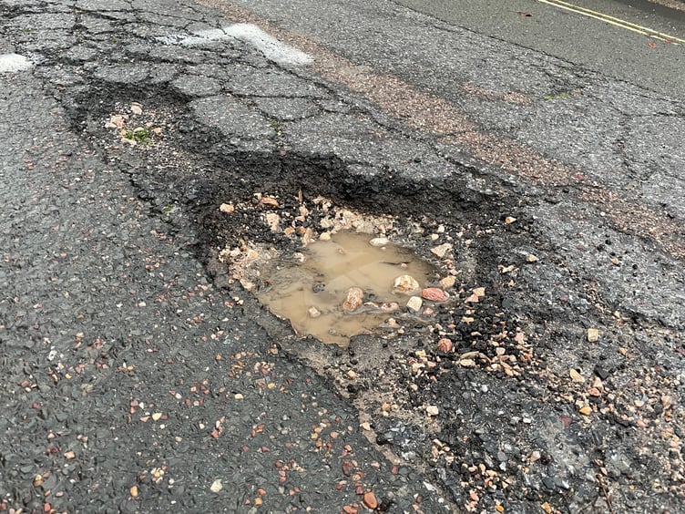 Pothole filled with rainwater