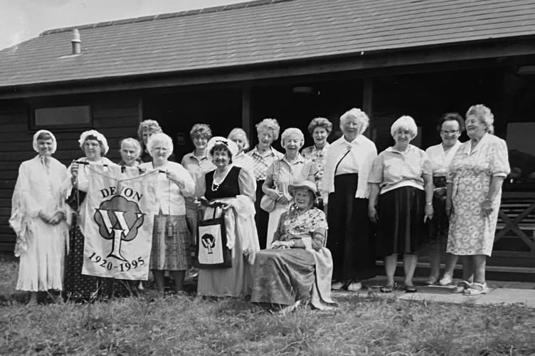 October 1995. Members of Combeinteignhead W.I. with the banner celebrating Devon Women's Institute 75th anniversary