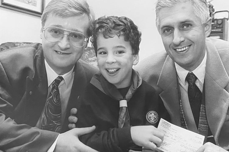 October 1995. Teignmouth Round Table presentation to 10 year old cub scout Christopher Fiddes who is pictured here with Round Table  secretary Paul O'Connell and chairman Mike Elms