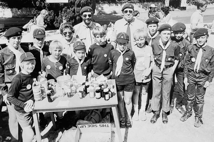 Members of the 4th Newton Abbot and Wolborough Scouts and Cubs manning their stand at St Paul's Church fete in June 1984