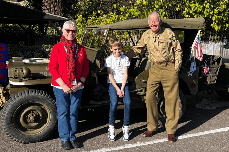 Poppy Appeal ambassador Joan Court, youngster Arlo Fishleigh and Jim Portus MBE