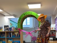 Author opens restocked school library