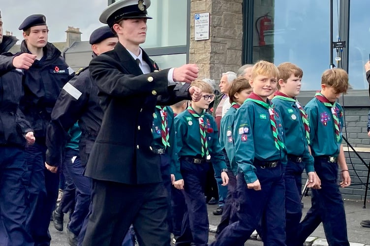 The Teignmouth Remembrance Parade arrives at the Cenotaph 2024