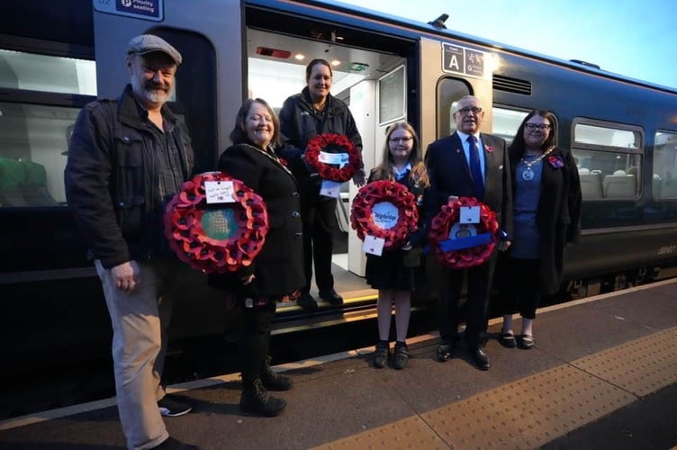 Mayor of Dawlish Cllr Rosie Dawson and RBL representatives put their poppies on the GWR train. Photo Bob Simpson 