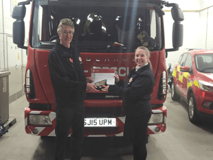 Firefighter's two decades of service recognised 
