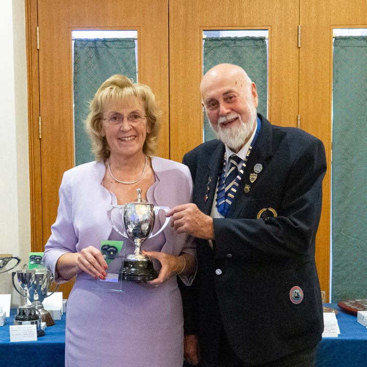 Tina Rowe, ladies champion, being presented by Rick Purnell