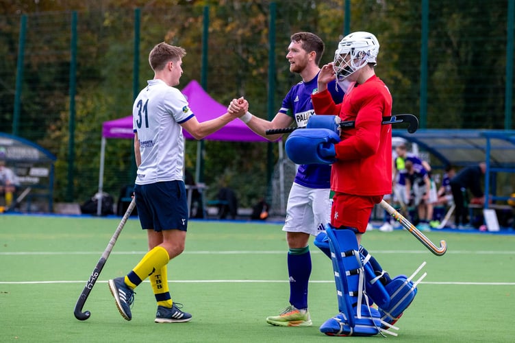 Winning goal scorer Rich Fisher with the end of match handshake
