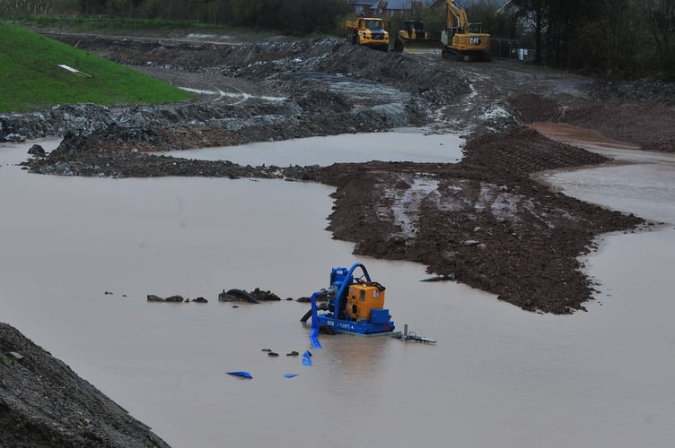 Storm Bert. Flooding between Teigngrace and Kingsteignton afer the River Teign burst its banks. One pump that might have its work cut out dealing with the deluge