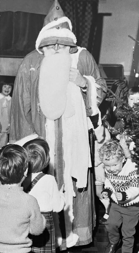 Father Christmas arrives at the Kingsteignton Playgroup Christmas Party in December 1970