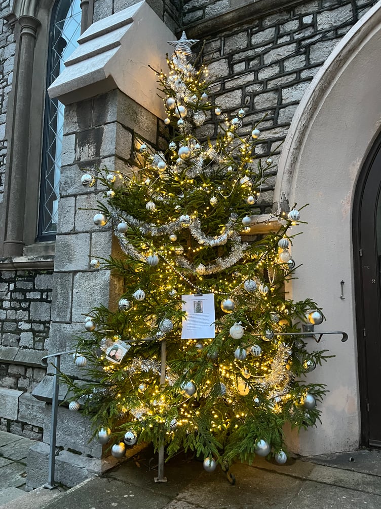 The illuminated Christmas Memorial Message Tree outside Teignmouth Methodist Church