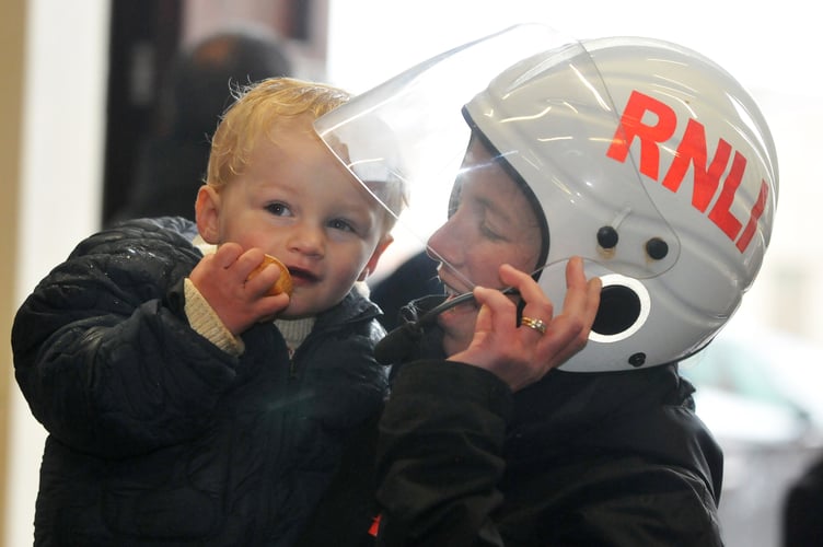 Teignmouth RNLI open boat house to let the public meet the new B-Class Atlantic 85 lifeboat Claude and Kath. Two year old Rafa Mole with mum and lifeboat crew member  Rosie Alterman