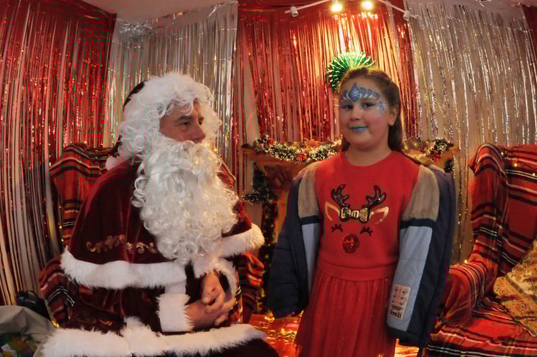 Teignmouth town centre welcomes the start of the Christmas season. Four year old Betty Reynolds from Dawlish gets to meet Father Christmas