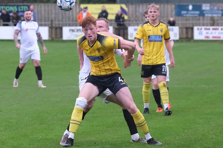 Rafael Beadman with eyes on the ball for Buckland Athletic