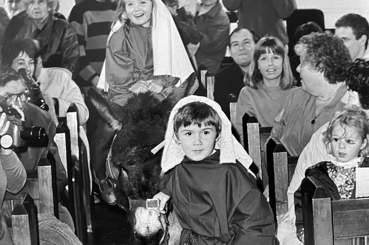 Ogwell Playgroup's nativity from 1993 featured a real donkey, pictured here with Luke Hickie as Joseph and Lucy Houghton as Mary