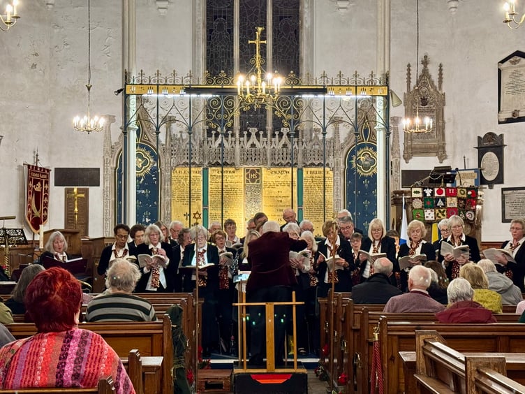 Teign Choral Society raising the roof of St James at its annual carol concert in aid of Teignmouth Hospital League of Friends (Photo: Viv Wilson)