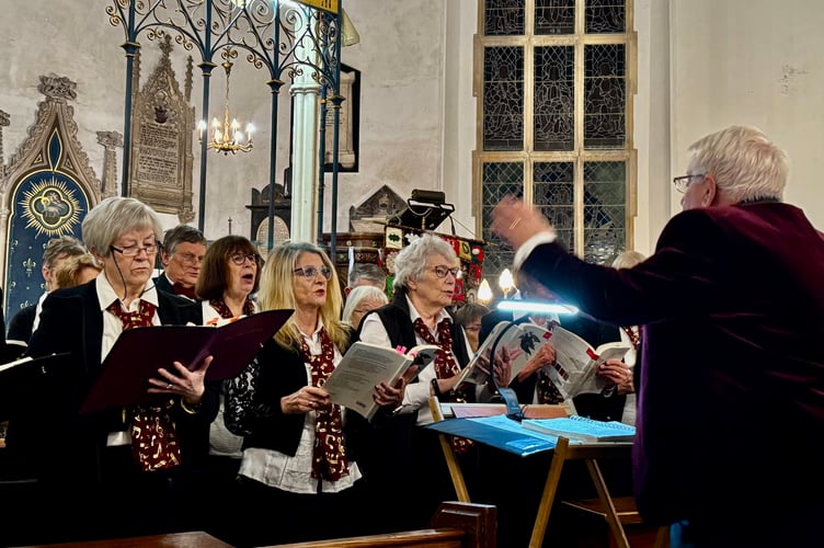 Conductor David Bowles directed the singers through the varied programme of choral works (Photo: Viv Wilson MBE)