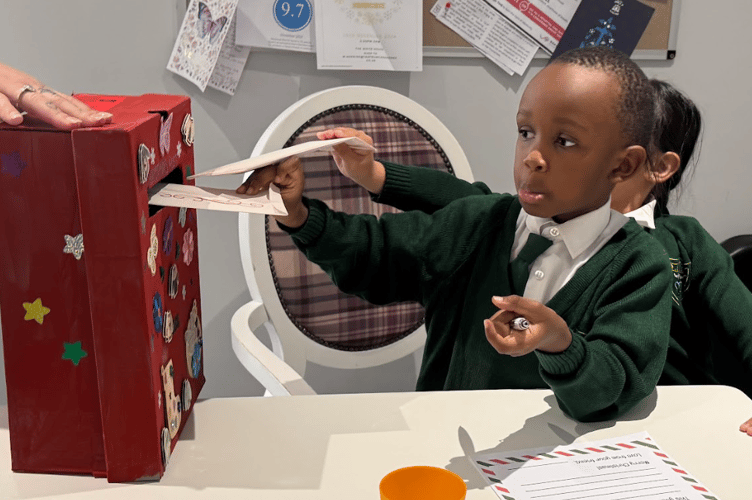 Children from OLSP posted their letters to Santa in a post box made by residents at The White House care home.